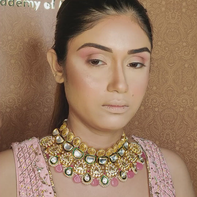 artist using small blending brush on model eyes