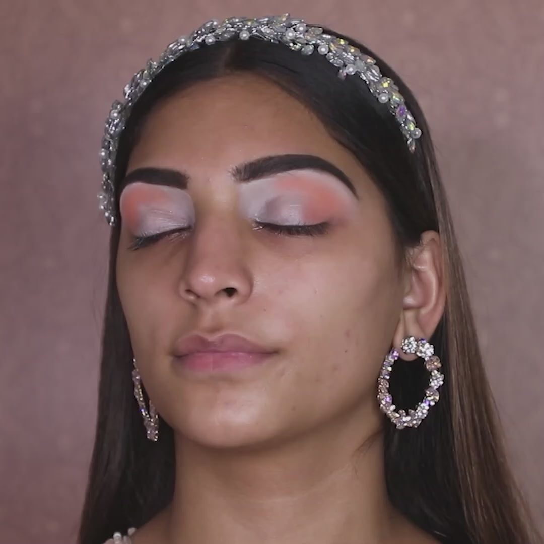 artist using blending brush on model eyelids