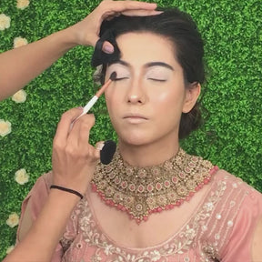makeup artist using tapered blending brush in the video